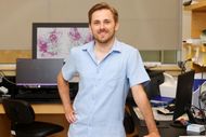 Young researcher, Colin MacKay, standing