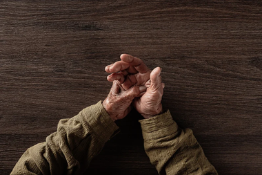 Elderly hands holding each other
